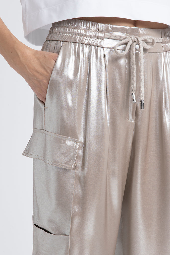 Baggy trousers in flowing silver laminated viscose twill  