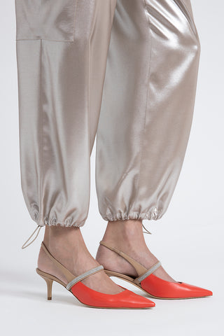 Baggy trousers in flowing silver laminated viscose twill  