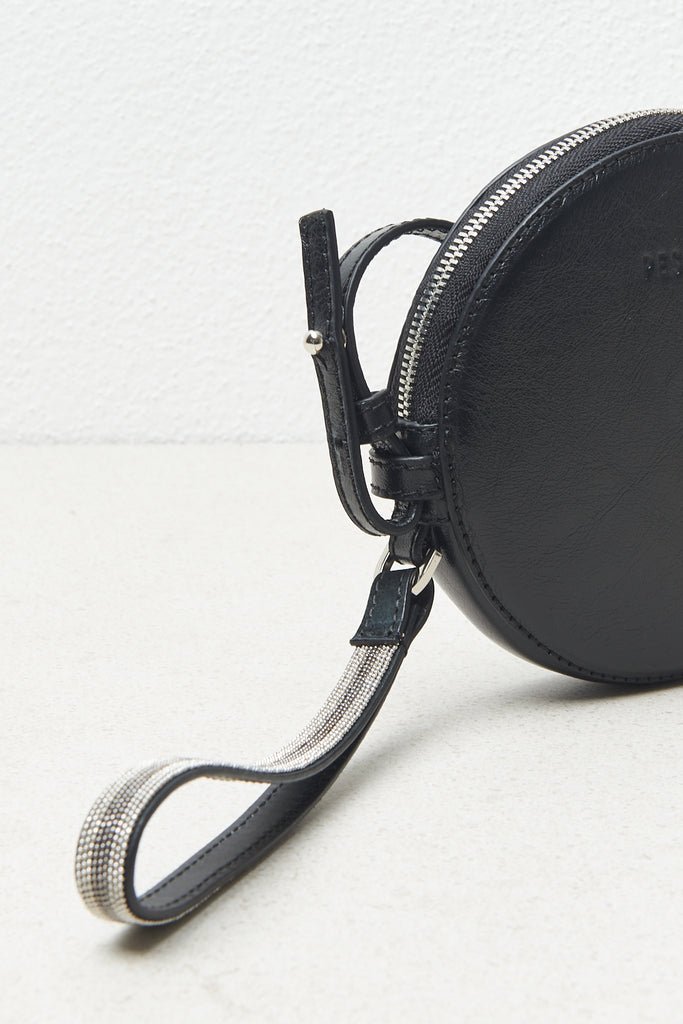 Round leather bag with cuff strap and shoulder strap  