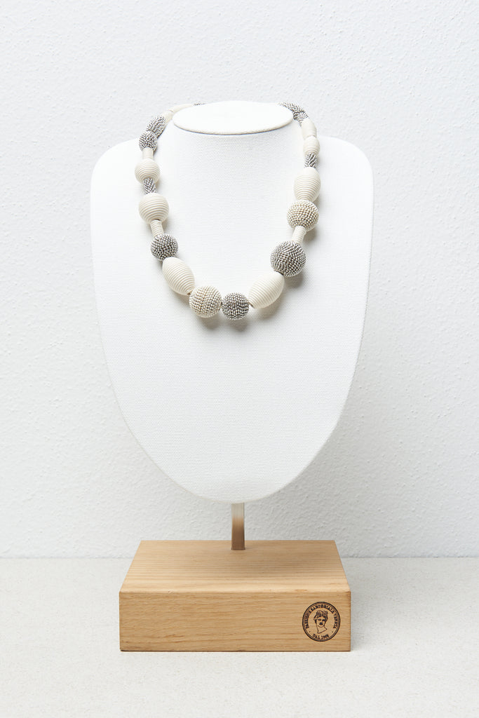 Necklace with wooden, metal and cotton yarn beads  