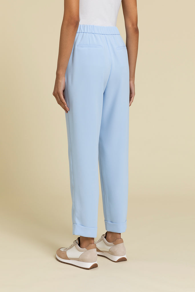 Pull-up trousers with tailored turn ups in fluid crepe cady  