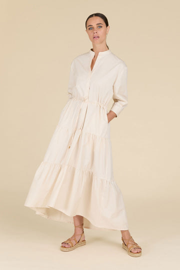 Flounced dress with deep neckline in light pure cotton satin with diamond cut chain trim on the shoulders  