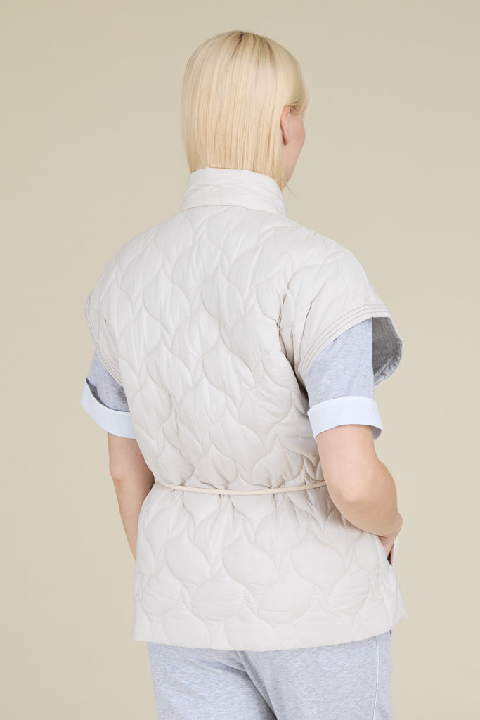 Quilted vest in soft peachskin microfibre with drawstring waist and sparkling diamond cut chain trim on the shoulders  